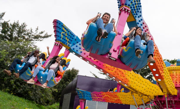 istock Happy women having fun in an amusement park 1051005954