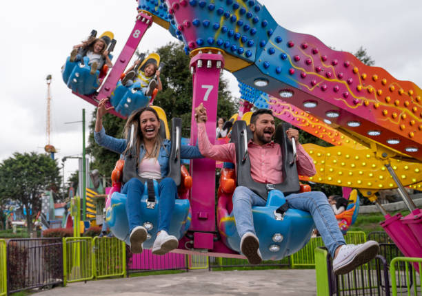 istock Happy family having fun in an amusement park 1051005968