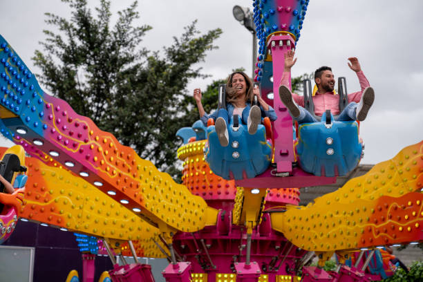 istock Happy couple having fun in an amusement park 1051005984
