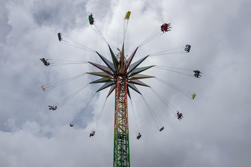 People enjoying a fun ride at an amusement park - lifestyle concepts