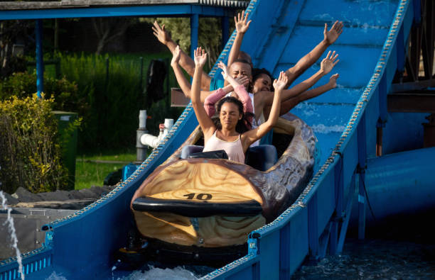 istock Happy family having fun in an amusement park 1051006162
