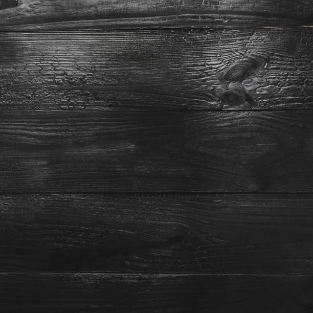 istock Upper, top view of a black wooden, square blackboard background in old, rustic style 1051009224