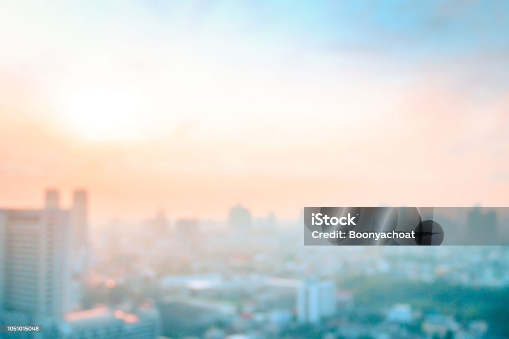 Background of cityscape concept Abstract blurred aerial view city on twilight color sky and clouds City Stock Photo