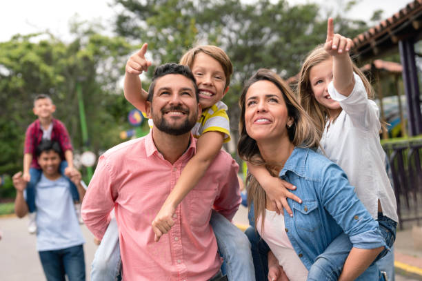 istock Happy family having fun at the park 1051015336