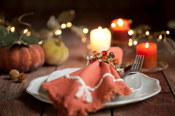 istock Autumn Thanksgiving holiday dining table place setting on an old wood rustic table 1051034942