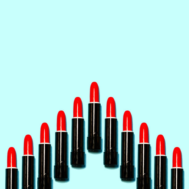 istock Set of red lipsticks isolated on blue color background. 1051038758