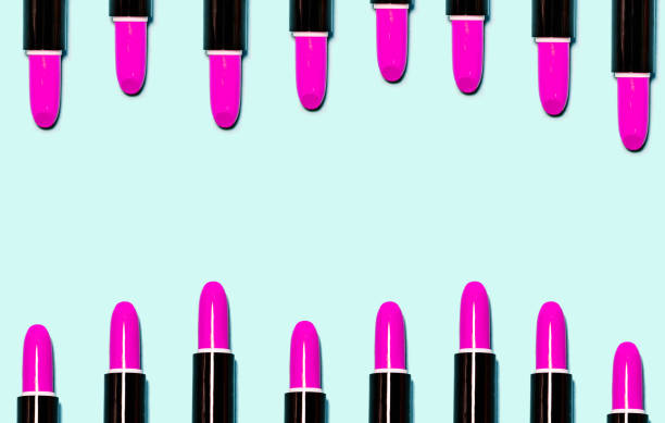 istock Set of pink lipsticks isolated on light blue color background. 1051038878