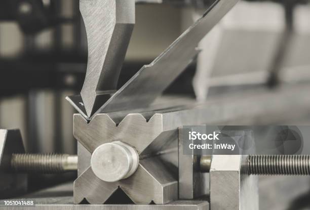 Bending Metal On A Sheet Bending Machine At The Factory Stock Photo - Download Image Now