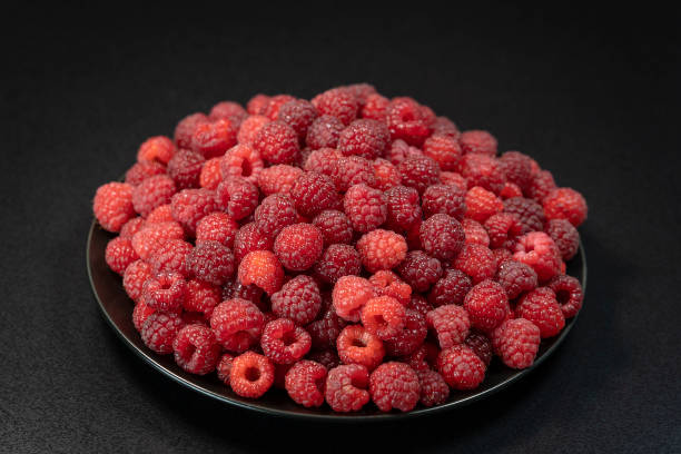 istock Fresh, ripe, juicy red raspberry background, close up berry, macro 1051052256