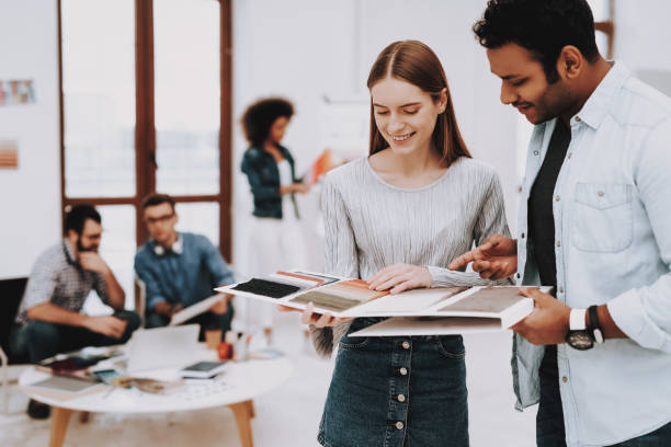 istock Guy. Girl. Talking. Young Specialists. Designers. 1051052386