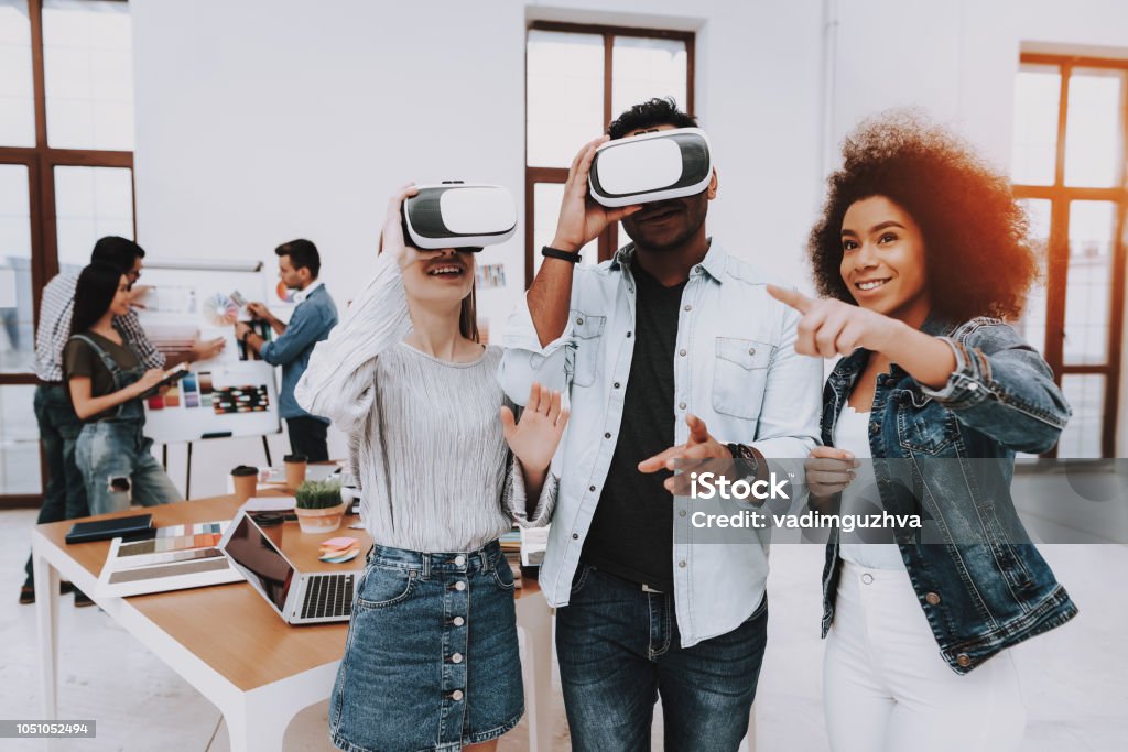 Brainstorming. Virtual Reality Glasses. Look. Brainstorming. Virtual Reality Glasses. Look. Designers. Young Specialists. Choose Colors for Design. Teamwork. Discussion. Design Studio. Multi-Ethnic. Project. Creative. Workplace. Virtual Reality Simulator Stock Photo