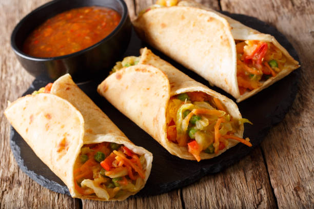 istock Indian veg spring roll stuffed with various vegetables close-up. Horizontal 1051064924