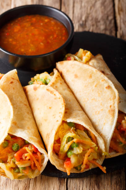 istock Indian food Frankies: Roti roll stuffed with vegetables close-up. vertical 1051064998