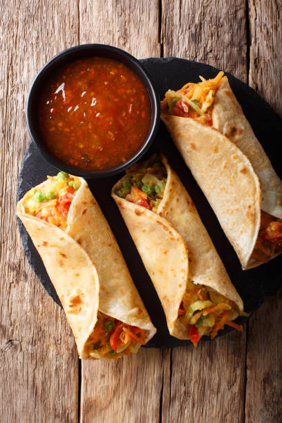 istock Indian veg spring roll stuffed with various vegetables close-up. Vertical top view 1051065052