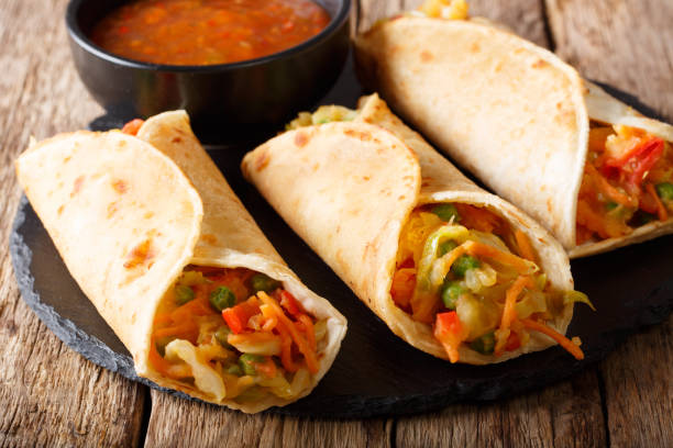 istock Indian street Veg roll Frankie stuffed with vegetables close-up. horizontal 1051065210