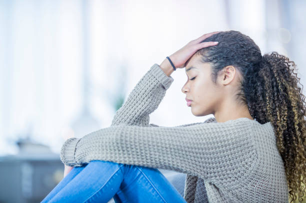 istock Sad Girl In Her Bedroom 1051068192