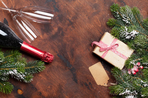istock Christmas gift box and champagne bottle 1051071068