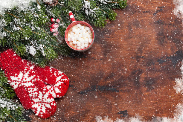 istock Christmas card with mittens and hot chocolate 1051071256