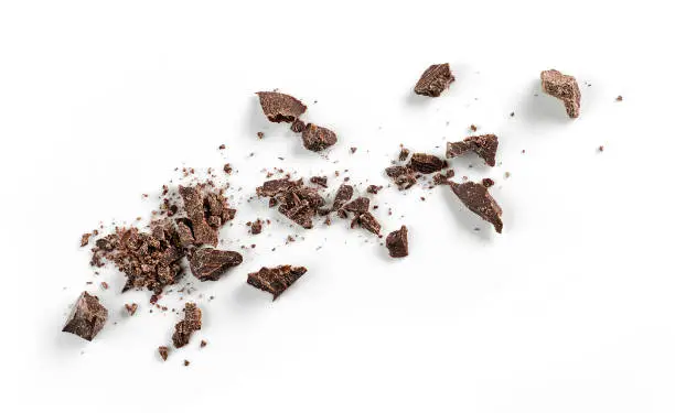 small chocolate crumbs isolated on white background, top view