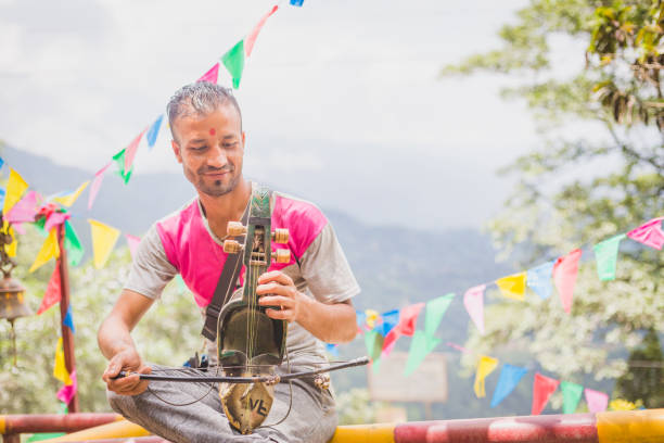 kathmandu,Nepal - Aug 23,2018: A Man Playing Sarangi,a traditional nepali musical instrument in kathmandu.