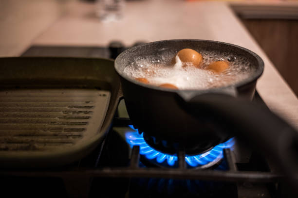 istock Boling eggs in cooking pot on gas stove burner. 1051081874