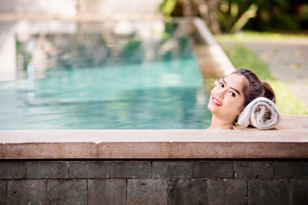 istock Young asian woman leaning back with white towel 1051084886