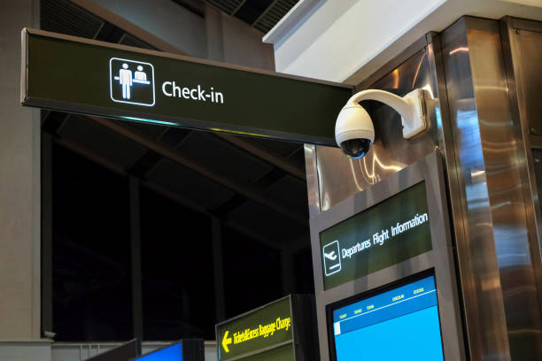 Security CCTV camera in airport check-in area Security CCTV camera in airport check-in area entrance sign photos stock pictures, royalty-free photos & images