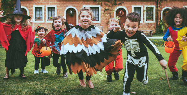 istock Little kids at a Halloween party 1051095532