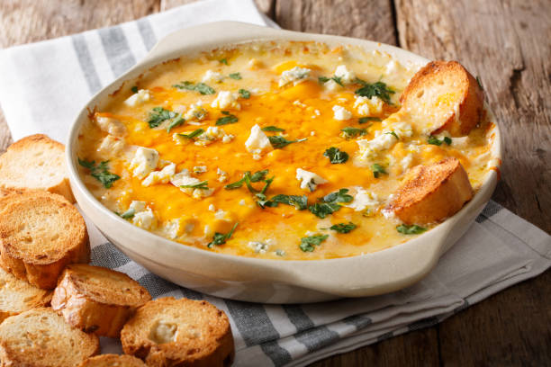 istock American food: hot chicken buffalo dip close-up in a baking dish with toasted bread. horizontal 1051095536