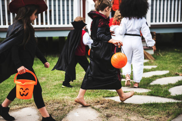 istock Young kids trick or treating during Halloween 1051096122