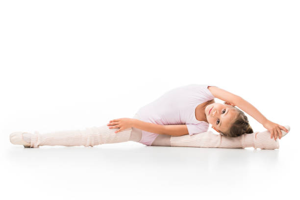 istock little ballerina doing twine and stretching isolated on white background 1051098520