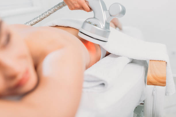 istock selective focus of woman on massage table getting electrical massage done by cosmetologist in spa salon 1051100742