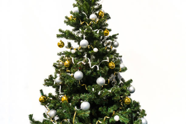 istock decorated Christmas tree isolated on white background. Christmas tree decorated with yellow and white balls and tinsel 1051102482