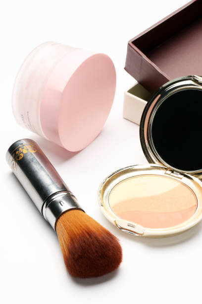 istock Blusher/powder  and a cosmetic brush isolated on white background 1051103742