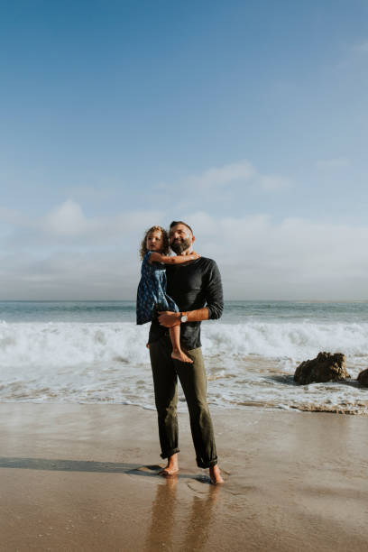 istock Dad and daughter at the beach 1051104712
