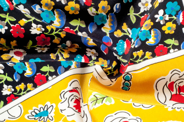 istock Texture background pattern. Silk fabric, floral pattern on a yellow background. On a black background. Flower textile or fabric. Texture of fabric. Fabric, textiles, fabric, material, woven. 1051106886