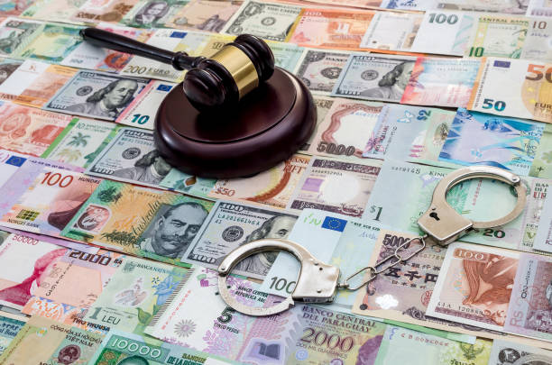 istock Judge gavel with handcuffs on banknote mix 1051110560