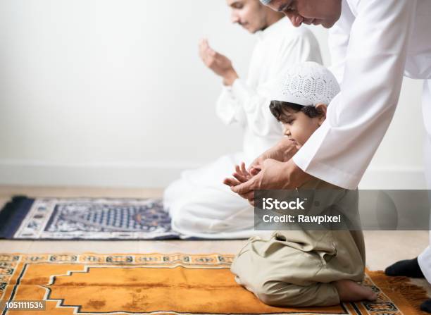 Muslim Boy Learning How To Make Dua To Allah Stock Photo - Download Image Now - Islam, Praying, Child