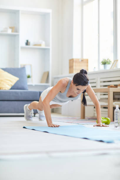 istock Girl training at home 1051115186