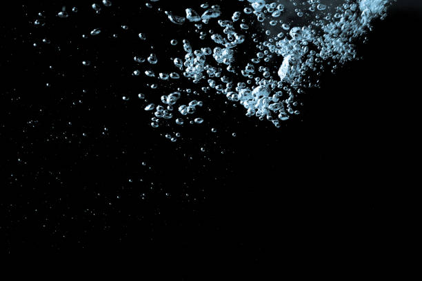 istock Pouring water has an abstract bubble on a black background 1051115734