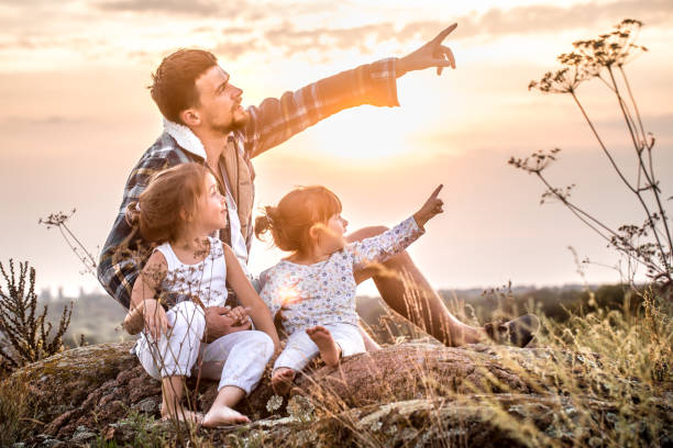 istock dad playing with two little cute daughters 1051115886