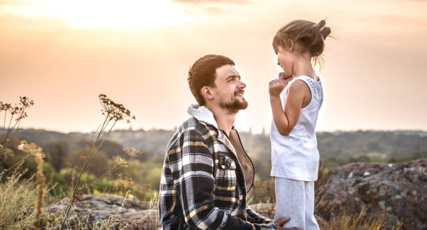 istock father and daughter at sunset, family values 1051115896