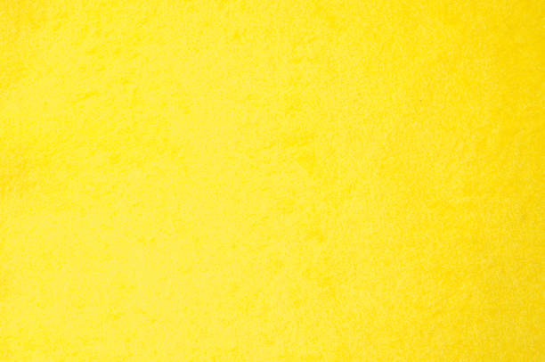 istock Texture background pattern. Woolen yellow fabric, cloth for a blanket, outer clothing.  Closeup horizontal fragment 1051117612