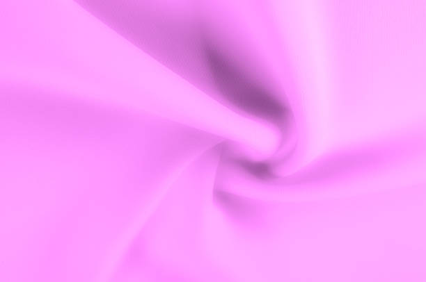 istock Soft focus. texture, pattern. Fabric of pink shades. For an elegant and modern look, bring your room to life with this light texture polyester! Although it has a luminous textured look, 1051118522