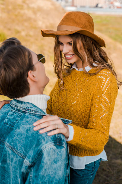 istock beautiful girlfriend smiling to boyfriend on rural meadow 1051119002