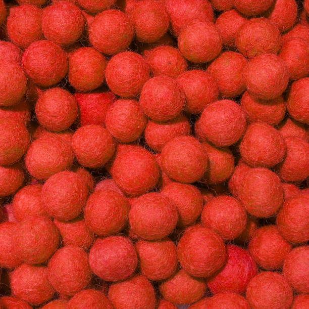 istock background of red balls of wool 1051128068
