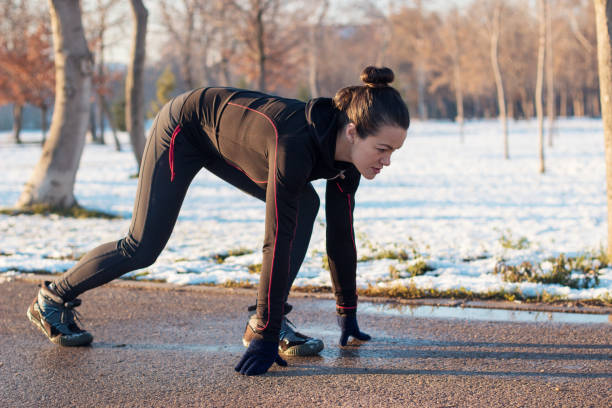 istock Woman exercising on cold winter day 1051131046