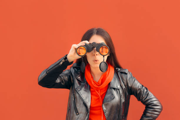 Visionary Millennial Girl Looking through Binoculars