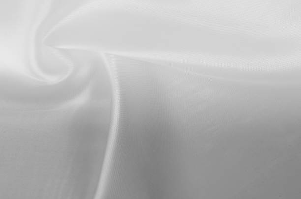 istock texture Cloth is white silk. Glowing like a layer of freshly fallen snow this antique white silk is absolutely stunning. A luxurious mixture of silk and wool gives him a smooth, slightly palpable hand 1051135940