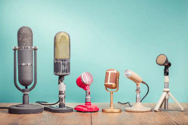 retro old microphones for press conference or interview recording on table front gradient aquamarine background. vintage old style filtered photo - 1960s style 1950s style record retro revival imagens e fotografias de stock